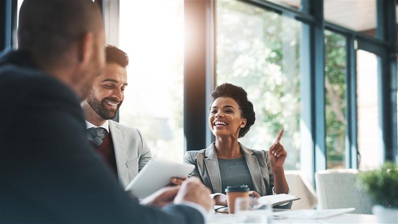 People smiling in a meeting